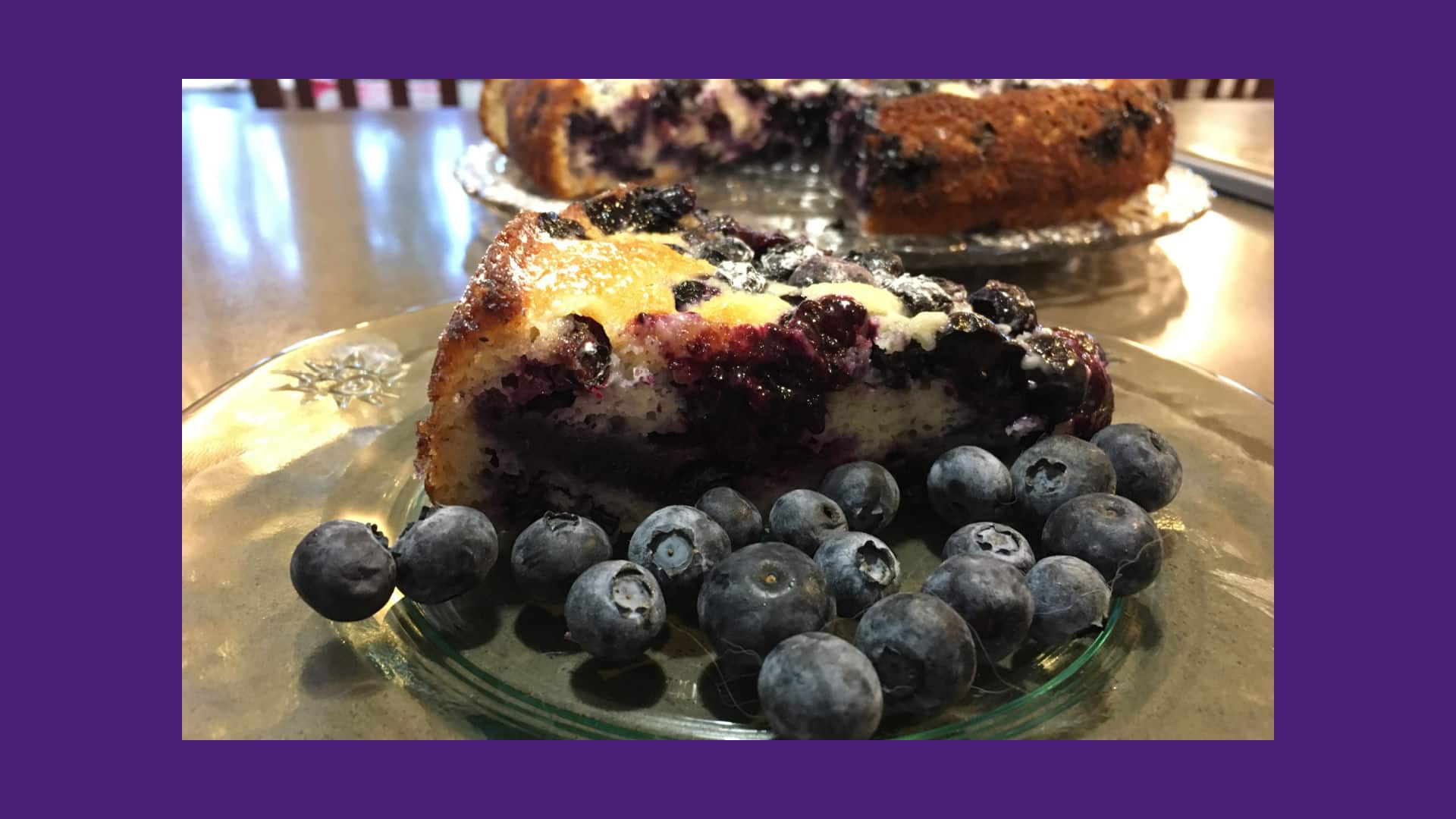 Blueberry Lemon Cake on a glass platter