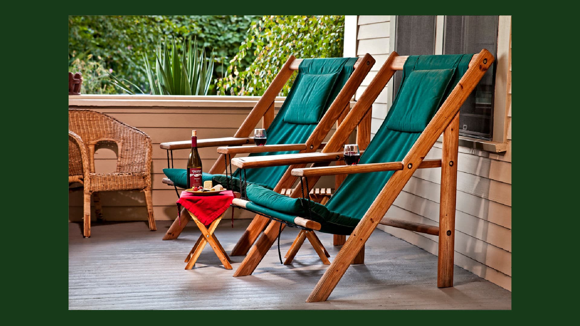 Two green Adirondack chairs on the front Porch