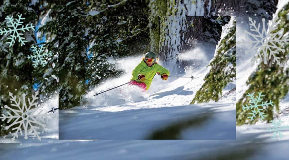 A skier in deep powder in the trees